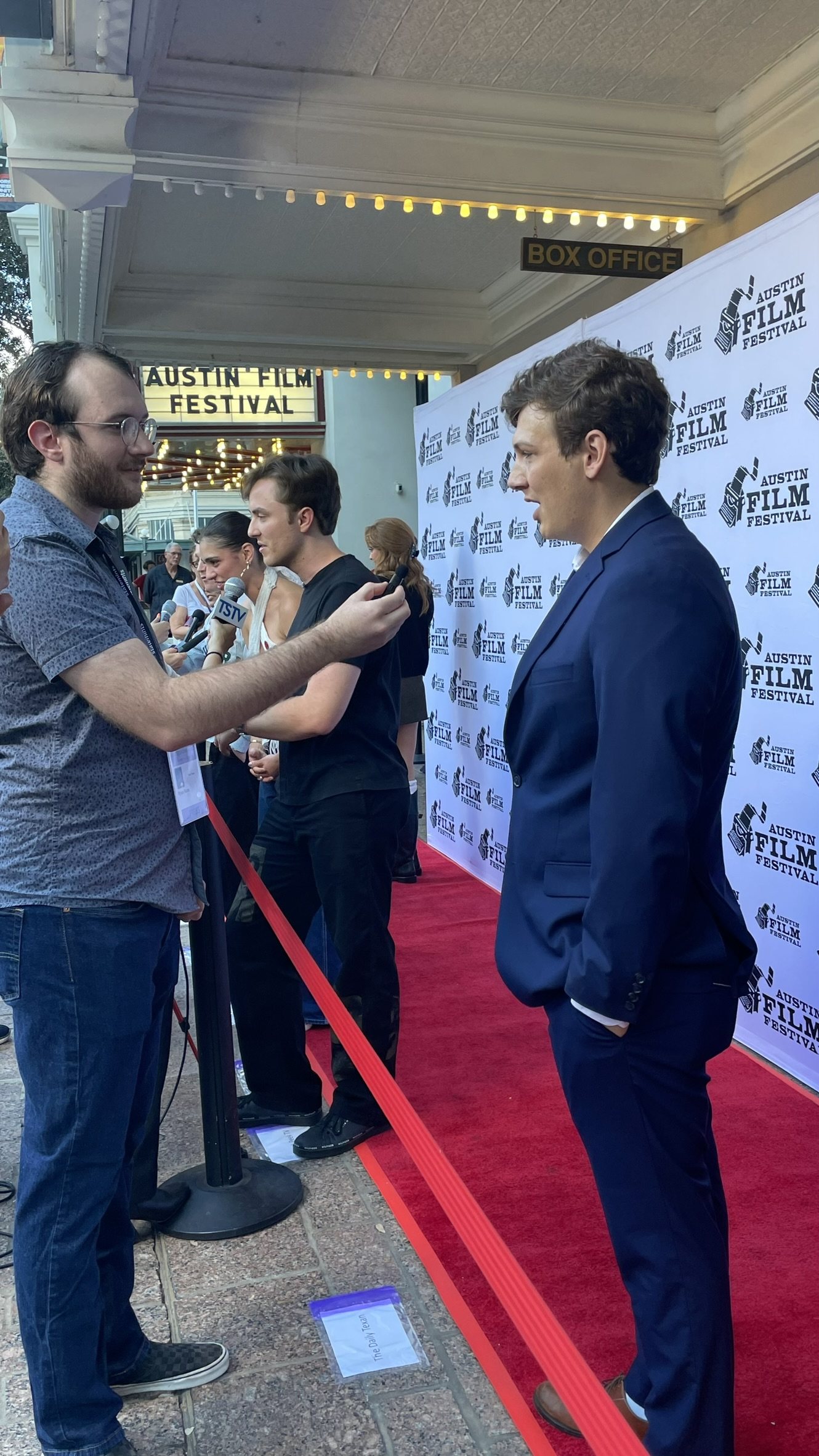 Eric participates in a red-carpet interview.